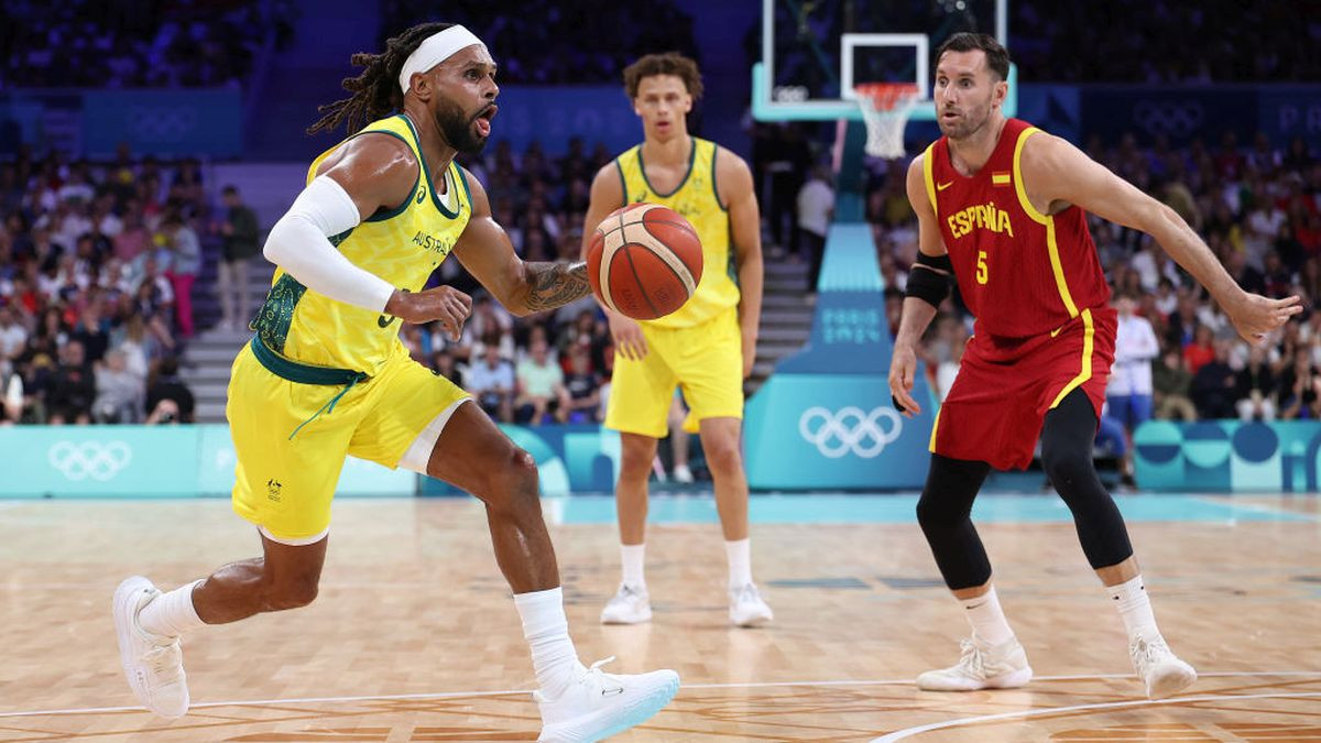 Patty Mills #5 of Team Australia dribbles the ball ahead Rudy Fernandez GETTY IMAGES
