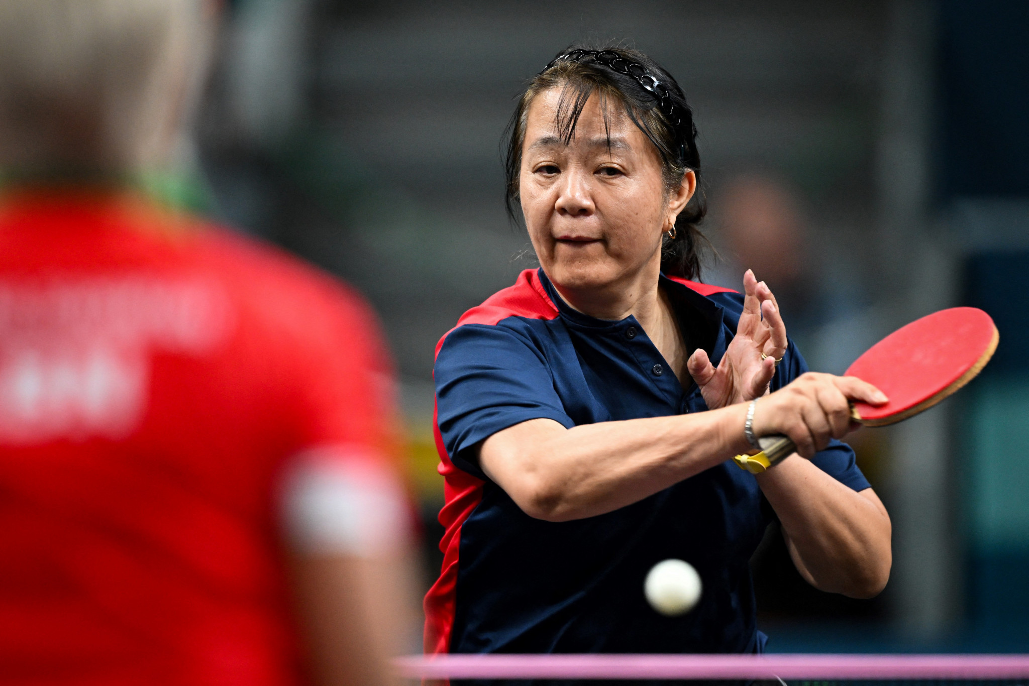 Chile's 58-year-old Zhiying Zeng competes in the women's table tennis singles at the Paris 2024 Olympic Games. GETTY IMAGES.