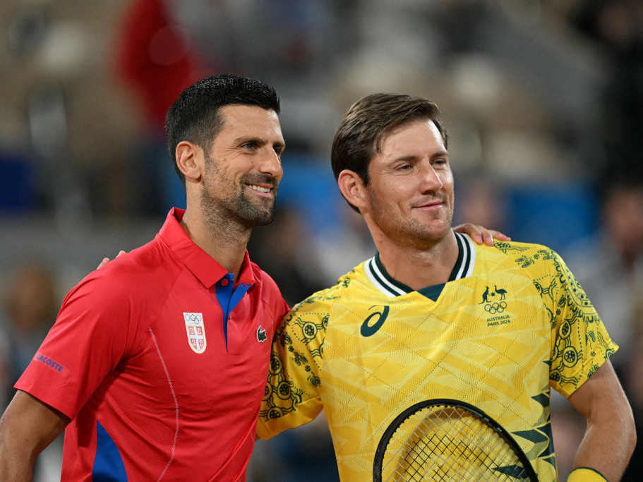 Serbia's Novak Djokovic poses with Australia's Matthew Ebden ahead of their men's singles. GETTY IMAGES