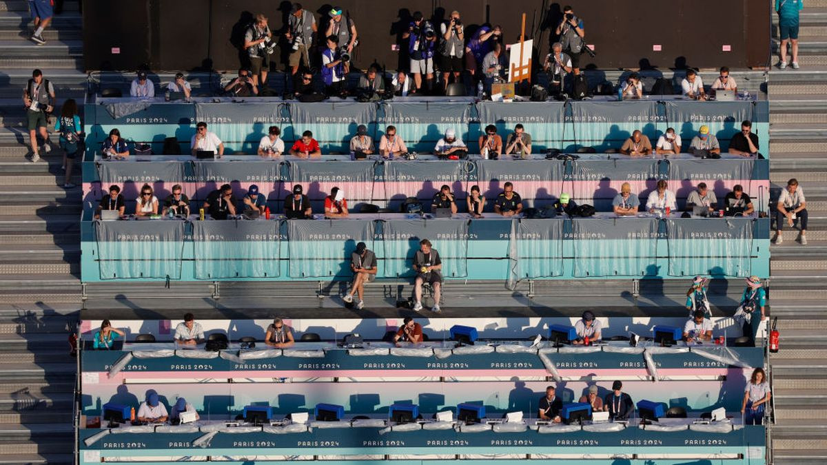 An aerial view of journalists working in the media area as they watch beach volleyball matches. GETTY IMAGES