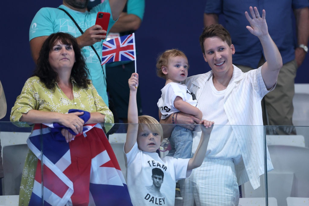 Tom's mother Debbie Daley, husband Dustin Lance Black and their children in Paris. GETTY IMAGES