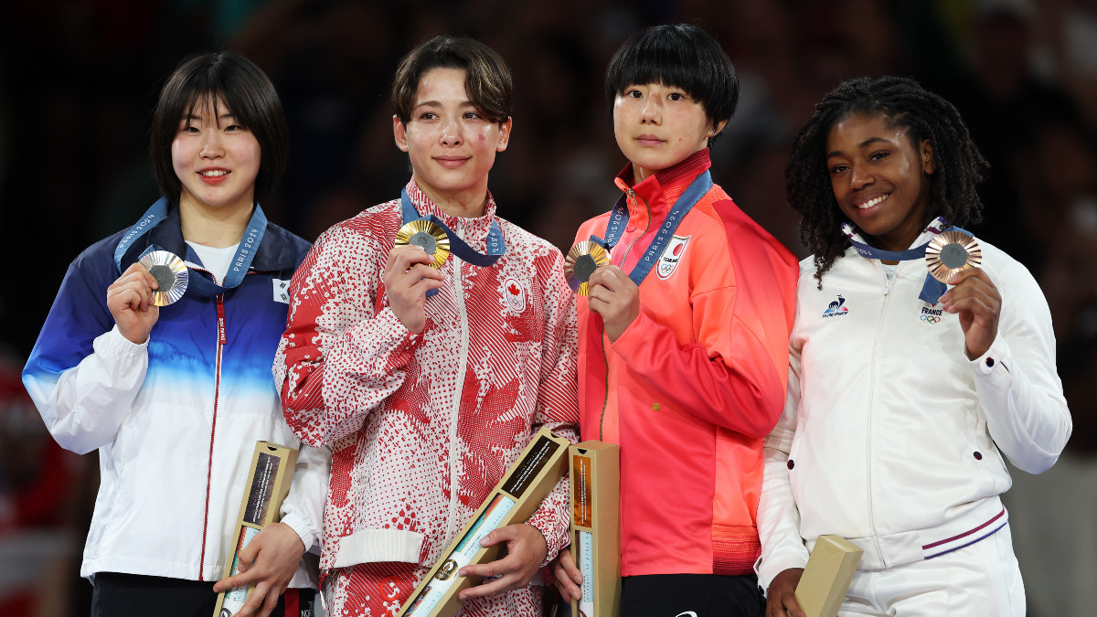 Medallists of the women's -57 kg category. GETTY IMAGES
