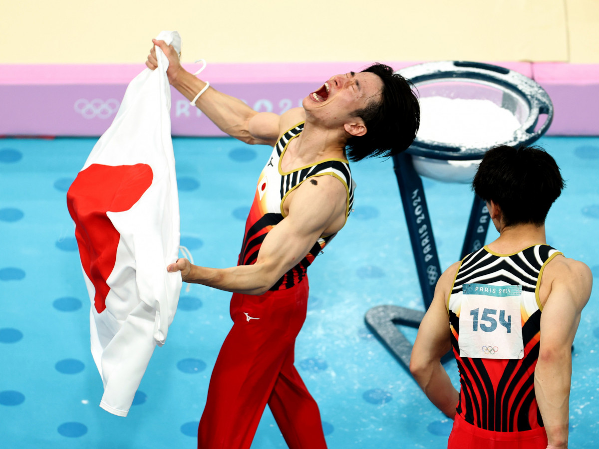 Japanese gymnasts Kazuma Kaya and Daiki Hashimoto of Team Japan celebrate after winning gold at the Paris 2024 Olympic Games. GETTY IMAGES