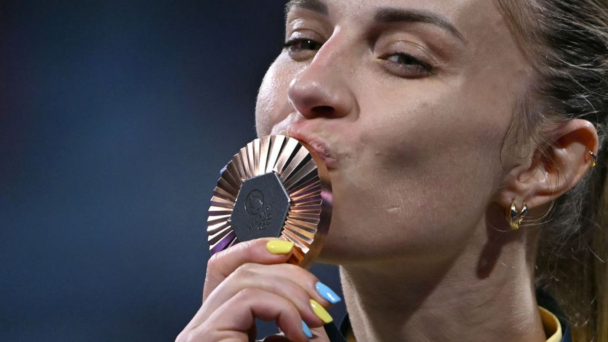 Bronze medallist Ukraine's Olga Kharlan celebrates on the podium during the medal ceremony. GETTY IMAGES