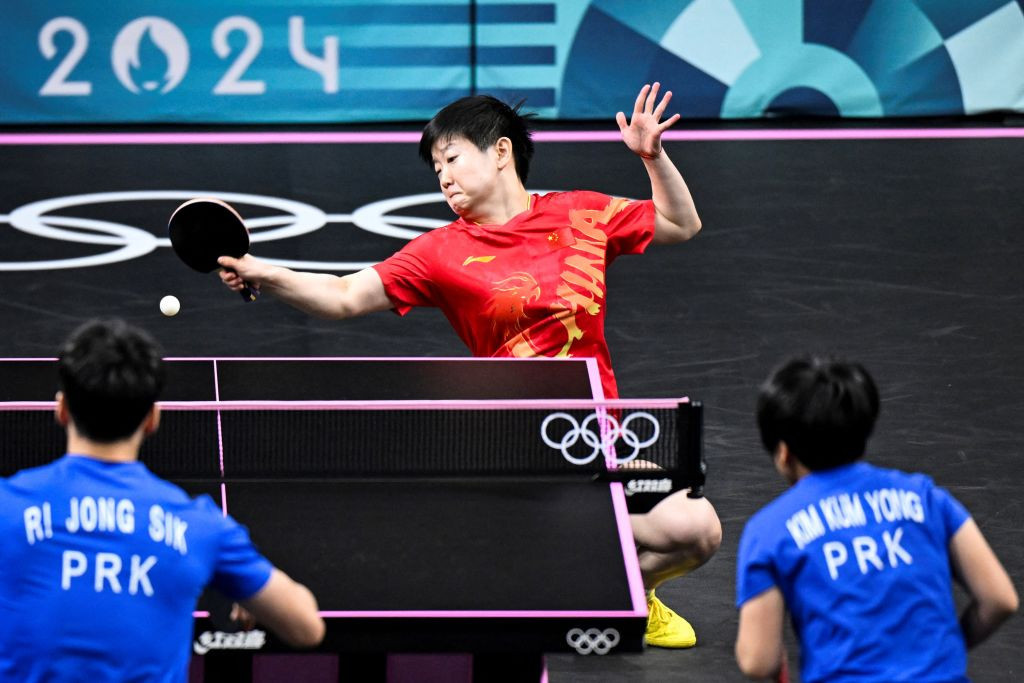Sun Yingsha plays a return during the mixed table tennis doubles gold medal match. GETTY IMAGES