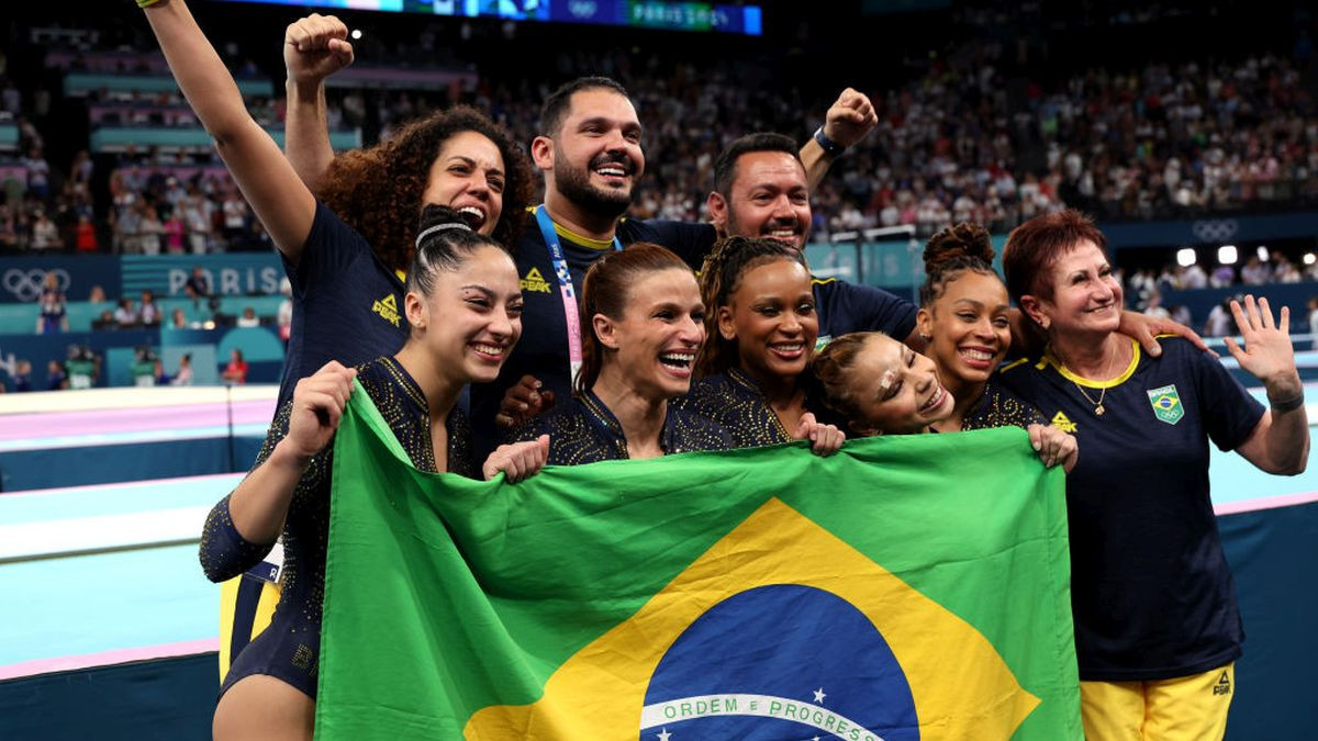 Bronze medalists Brazil line up with their flag before the medal ceremony for the Women's Team Final. GETTY IMAGES