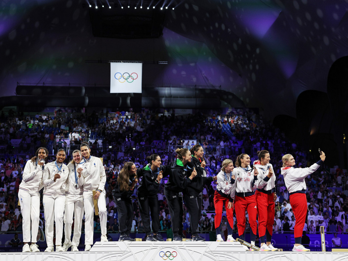 Team Italy, Team France, and Team Poland on the podium at the Fencing Women's Epee medal ceremony on day four of the Paris 2024 Olympic Games. GETTY IMAGES