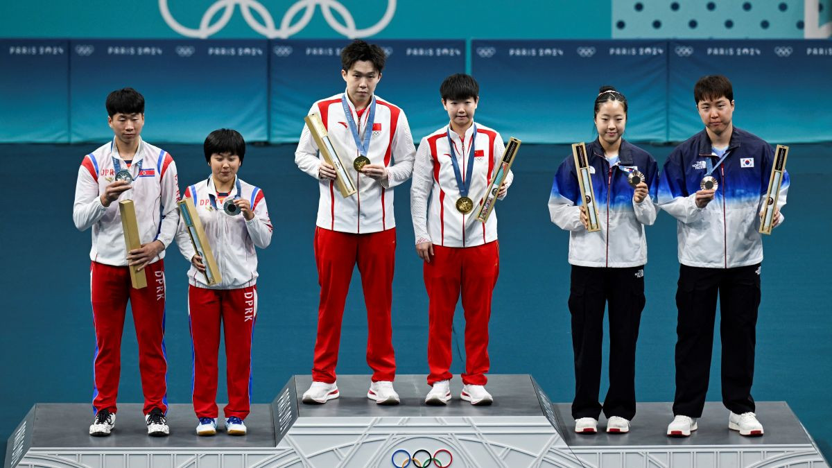 The teams from China, North Korea, and South Korea on the podium. GETTY IMAGES
