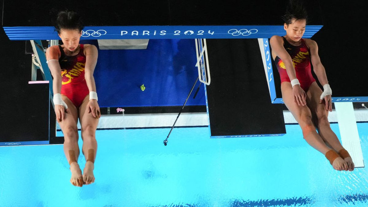 An overview shows China's Chen Yuxi and Quan Hongchan competing in the women's synchronised 10m platform diving final. GETTY IMAGES