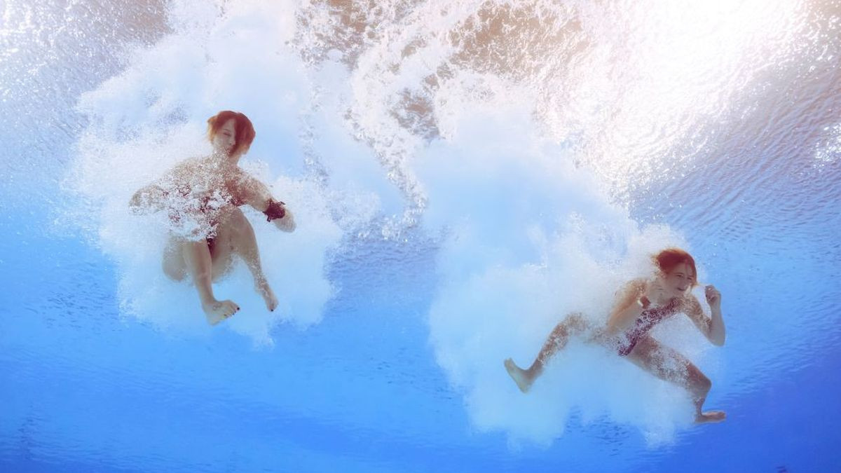 An underwater view shows Canada's Caeli Mckay and Kate Miller competing in the final. GETTY IMAGES