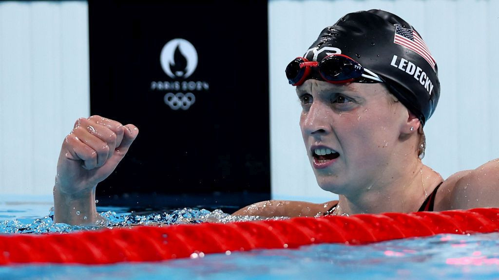 Katie Ledecky of Team USA celebrates after winning gold in the women's 1500m freestyle final. GETTY IMAGES