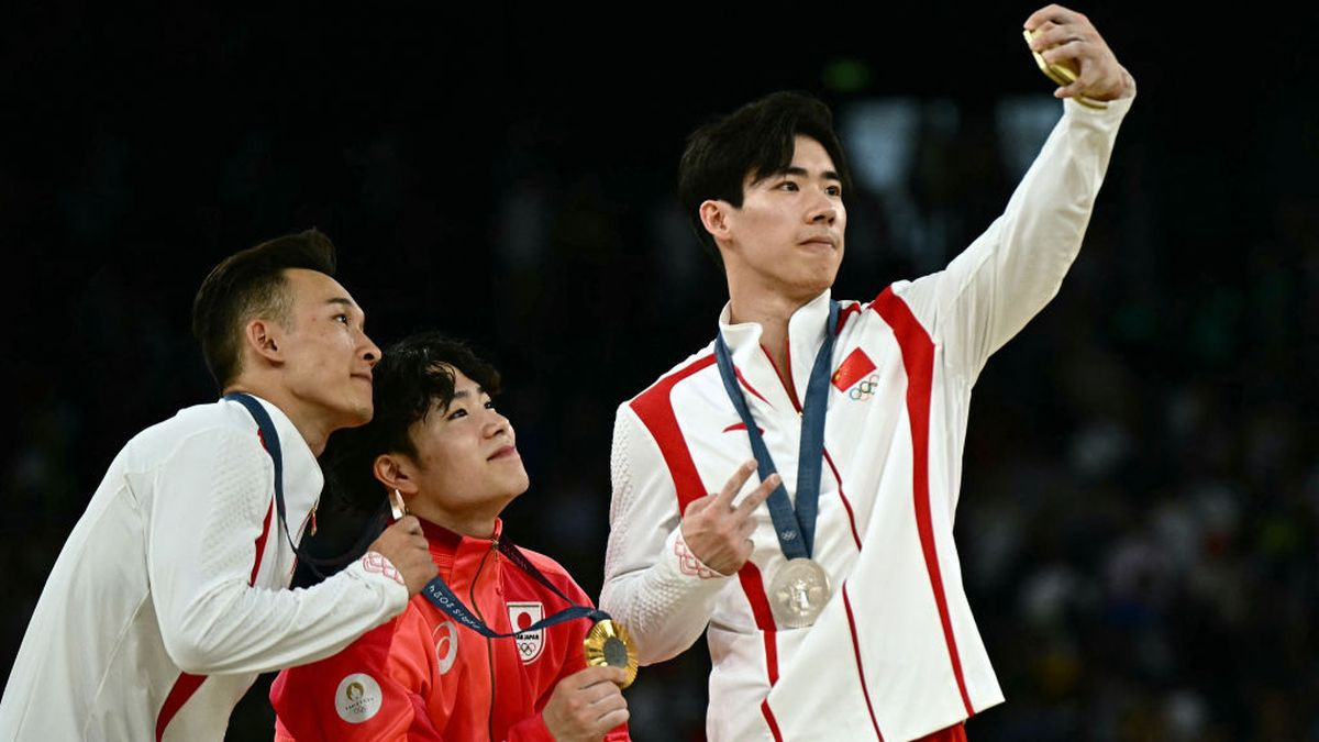 Medallists pose for a selfie during the podium ceremony GETTY IMAGES