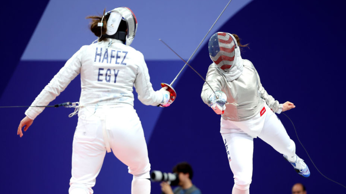 Nada Hafez and Elizabeth Tartakovsky (USA) compete in the Fencing Women's Sabre Individual Table of 32. GETTY IMAGES
