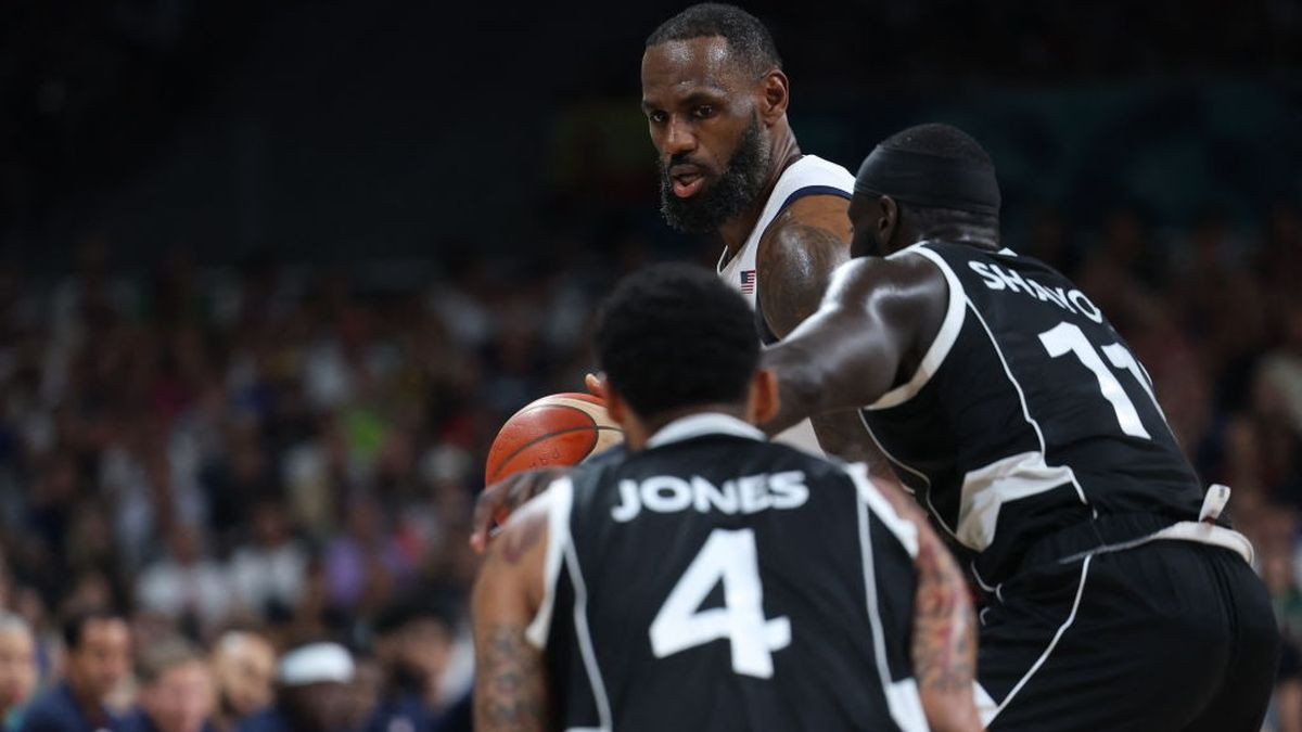 LeBron James (Rear) challenges South Sudan's #04 Carlik Jones and South Sudan's #11 Marial Shayok. GETTY IMAGES