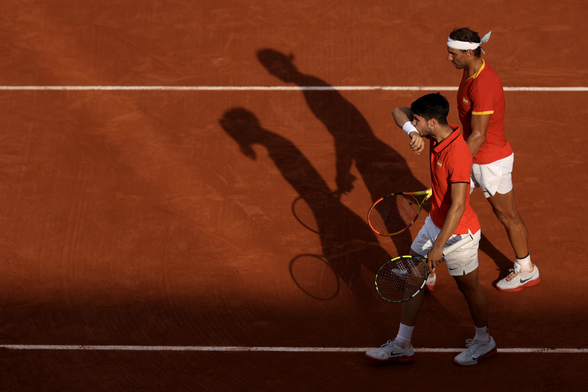 Rafael Nadal pictured alongside Team Spain teammate Carlos Alcaraz at a Men's Doubles match at the Paris 2024 Olympic Games. GETTY IMAGES