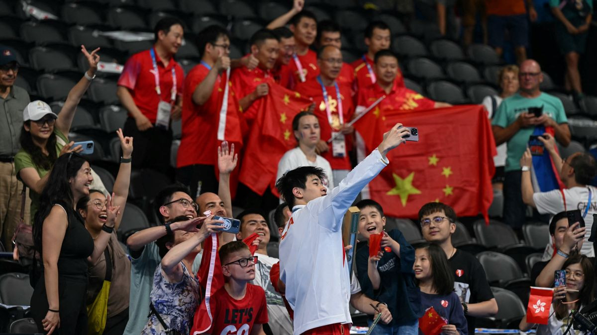 Zhanle takes a selfie with supoorters following the event. GETTY IMAGES