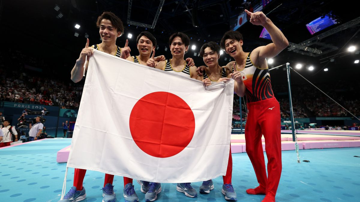 Team Japan celebrates after winning gold in Paris. GETTY IMAGES