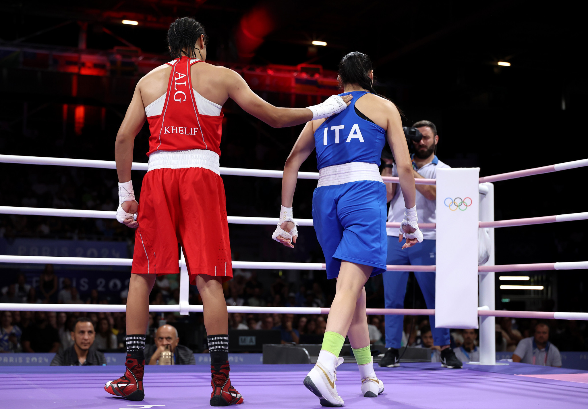Imane Khelif of Team Algeria interacts with Angela Carini of Team Italy after Carini abandoned the Women's 66kg preliminary round match at the Paris 2024 Olympic Games. GETTY IMAGES