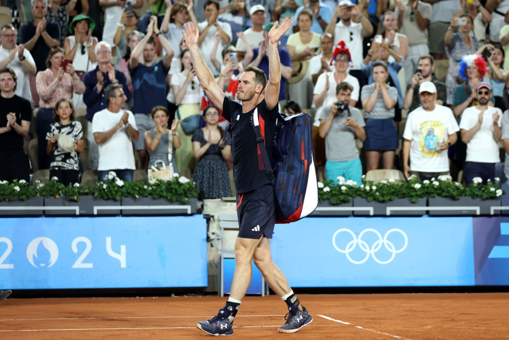 Andy Murray waves to the crowd as he exits the court for the last time. GETTY IMAGES