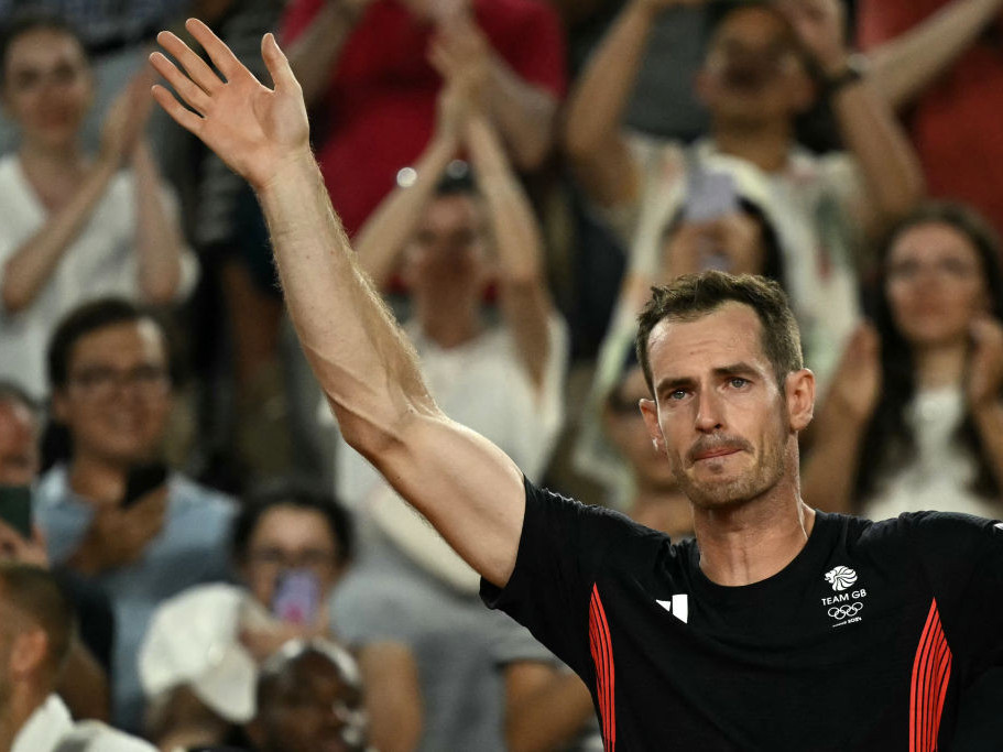 Andy Murray waves goodbye after playing his final game with Daniel Evans against the US in the men's doubles. GETTY IMAGES