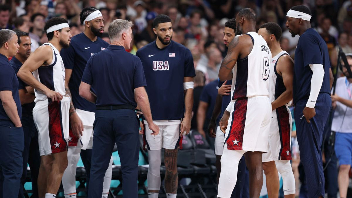 Jayson Tatum #10 of Team United States, middle, looks on during a Men's Group Phase. GETTY IMAGES