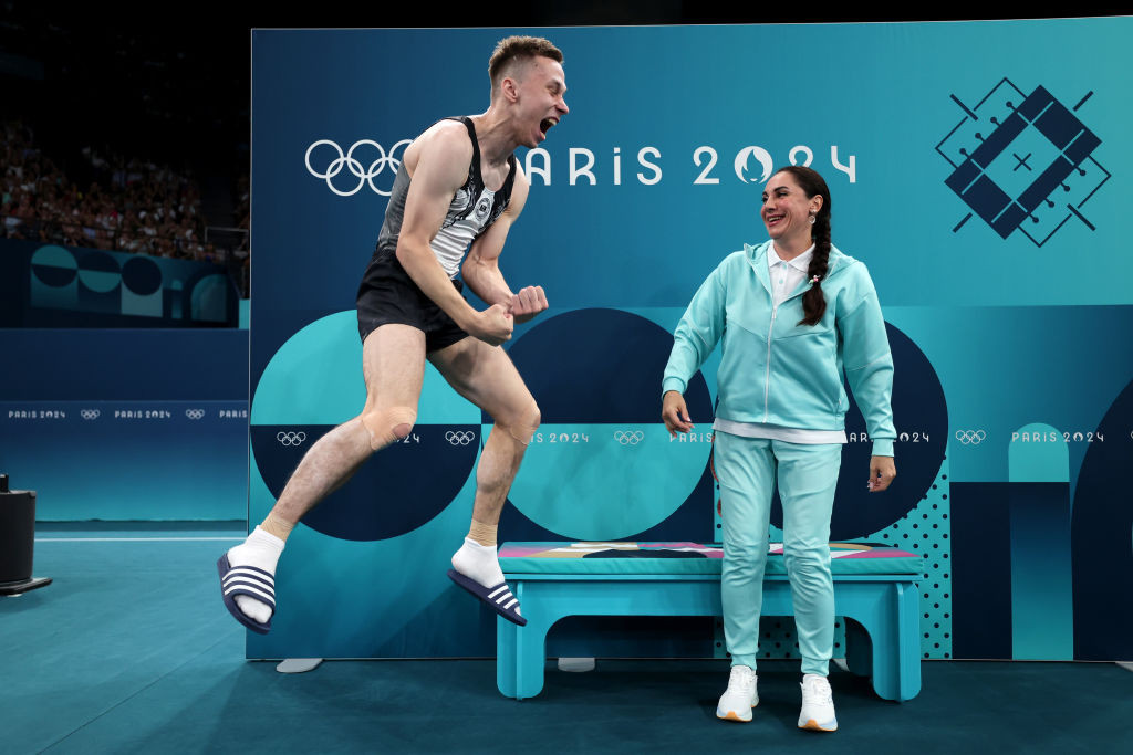 Ivan Litvinovich celebrates defending his trampoline title. GETTY IMAGES