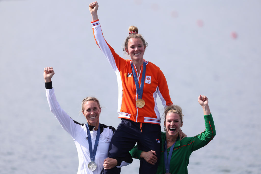 Emma Twigg and Viktorija Senkute raise gold medal winner Karolien Florijn in celebration. GETTY IMAGES
