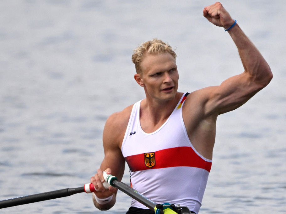 Germany's gold medallist Oliver Zeidler celebrates winning in the men's single sculls. GETTY IMAGES