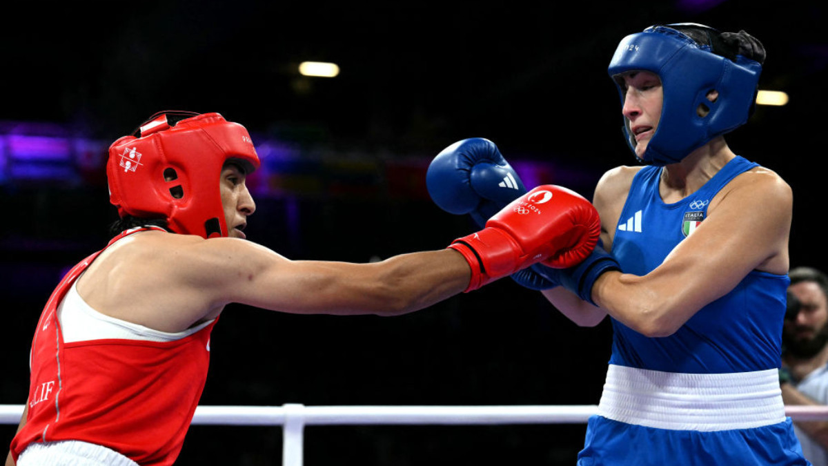 Algeria's Imane Khelif (in red) punches Italy's Angela Carini in the women's 66kg in Paris 2024. GETTY IMAGES