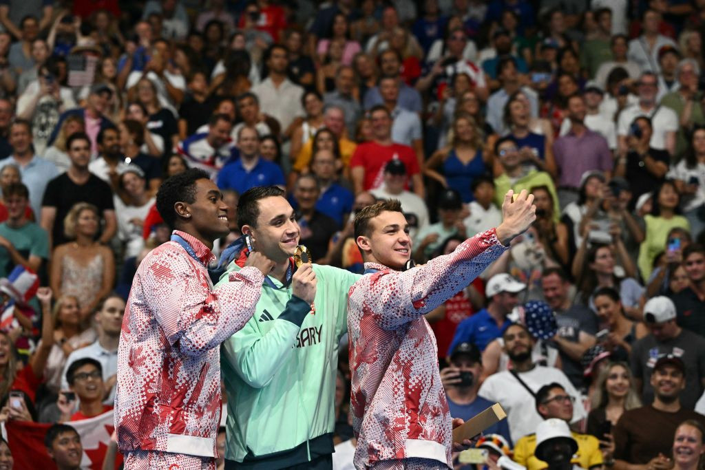 Silver medallist Canada's Josh Liendo, gold medallist Hungary's Kristof Milak and bronze medallist Canada's Ilya Kharun pose on the podium. GETTY IMAGES