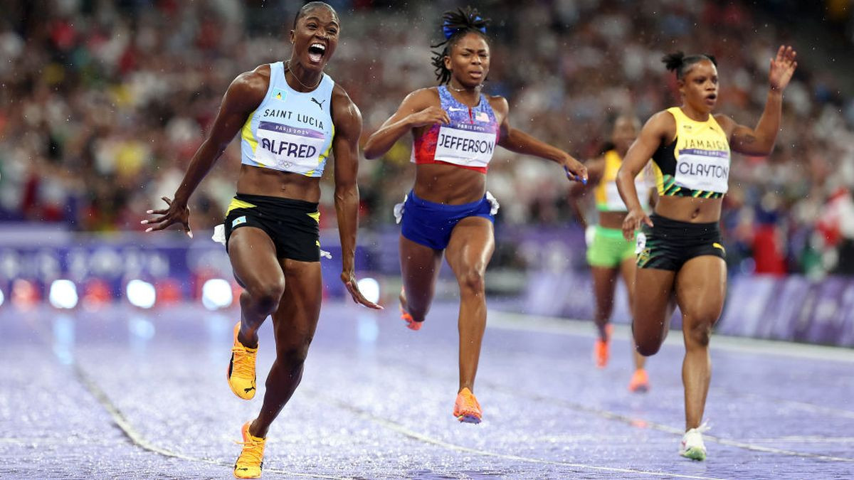 Julien Alfred of Team Saint Lucia crosses the finish line during the Women's 100m Final. GETTY IMAGES