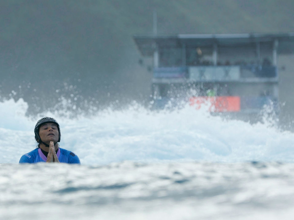 Pray for surf. Top competitors like Johanne Defay will have to wait until Monday for a chance at gold. GETTY IMAGES