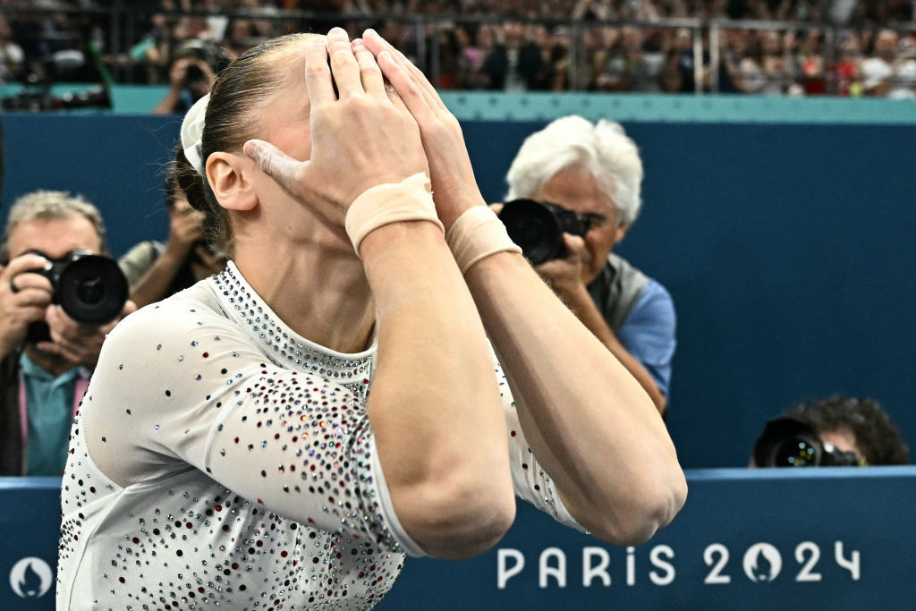 Algeria's Kaylia Nemour reacts after competing in the artistic gymnastics women's uneven bars final . GETTY IMAGES