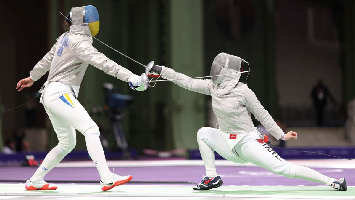 Alina Komashcuk of Team Ukraine and Shihomi Fukushima of Team Japan compete during the Fencing Women's Sabre Team match on day eight of the Olympic Games Paris 2024 at Grand Palais on August 03. GETTY IMAGES