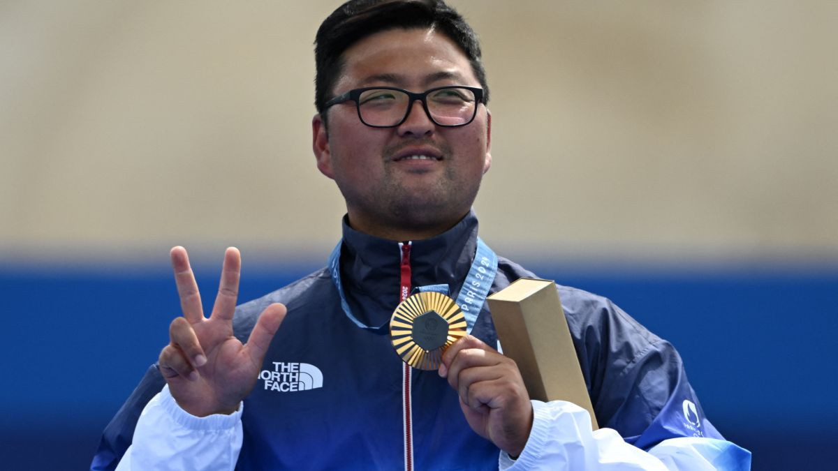 Kim Woojin poses on the podium during medal ceremony for the archery men's individual. GETTY IMAGES
