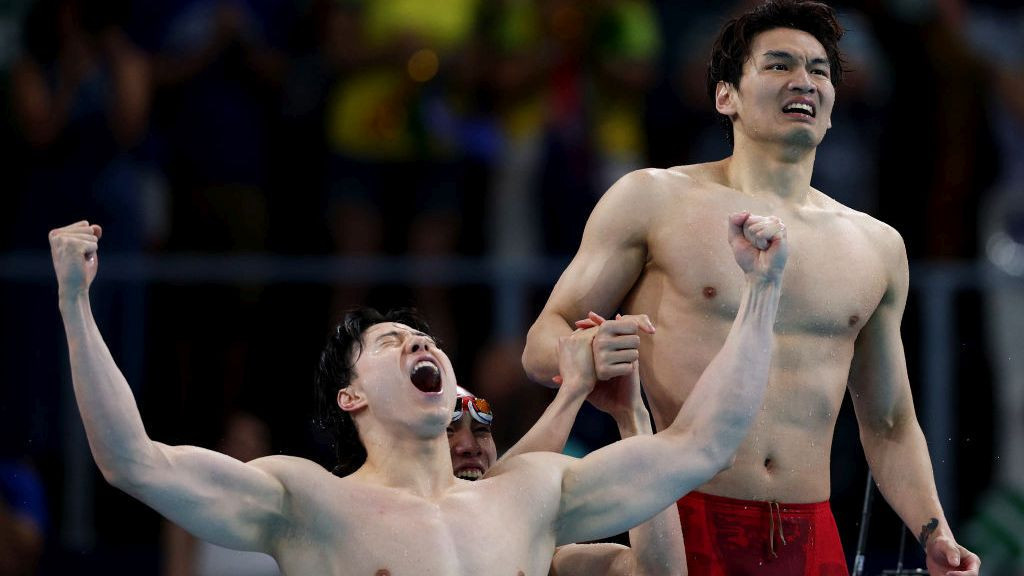 Qin Haiyang and Xu Jiayu of Team People's Republic of China celebrate after winning gold in the Men's 4x100m Medley Relay. GETTY IMAGES