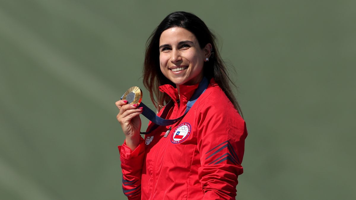 Crovetto celebrates on the podium at the Shooting Skeet Women's medal ceremony. GETTY IMAGES