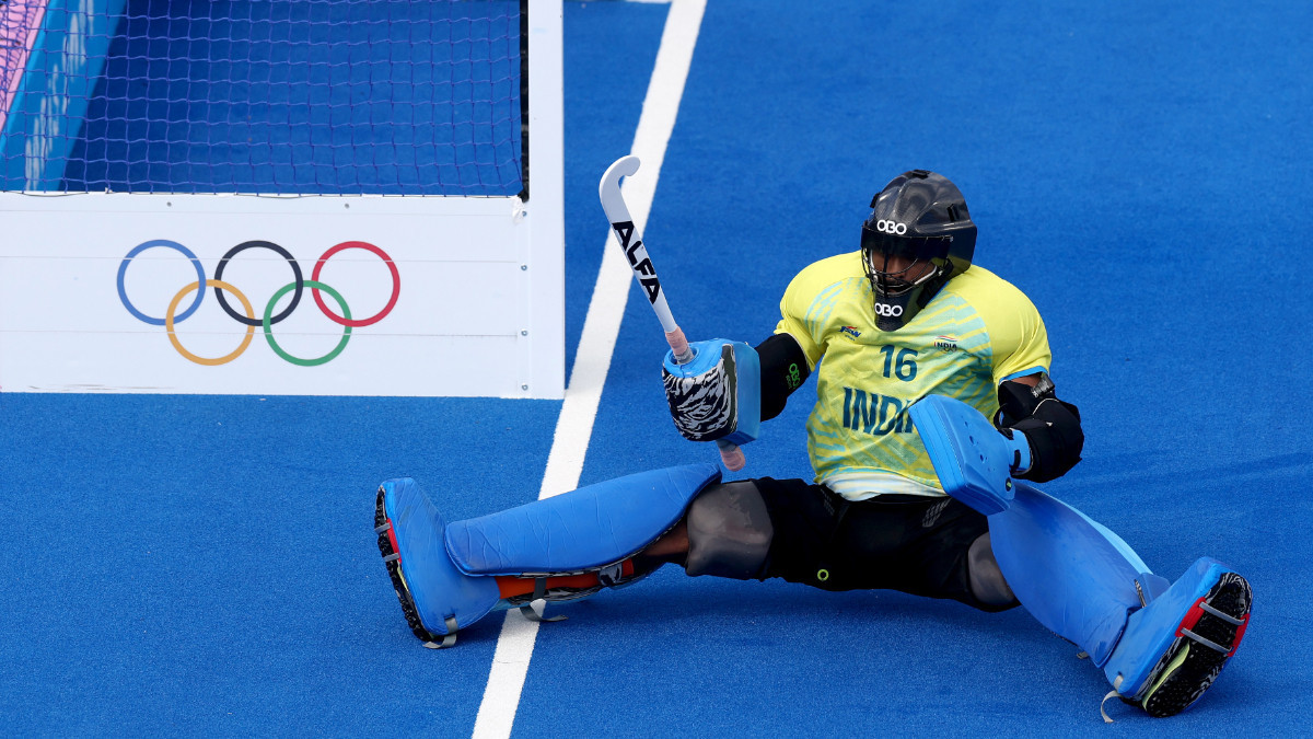 Raveendran of Team India celebrates after making a save from Phillip Roper of Team Great Britain in the penalty shootout. GETTY IMAGES
