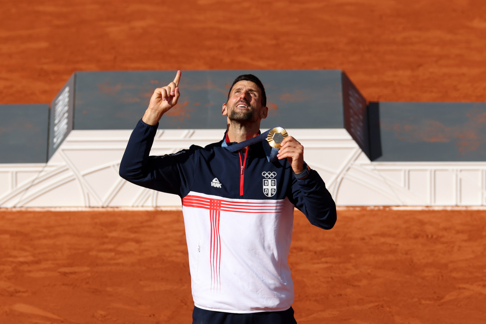 Novak Djokovic celebrates his gold medal. GETTY IMAGES