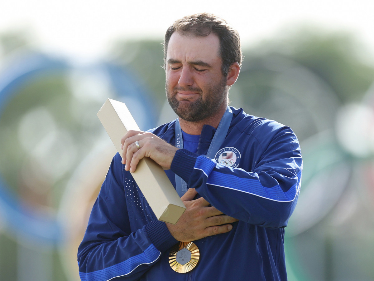 Scottie Scheffler was overwhelmed after clinching gold. GETTY IMAGES