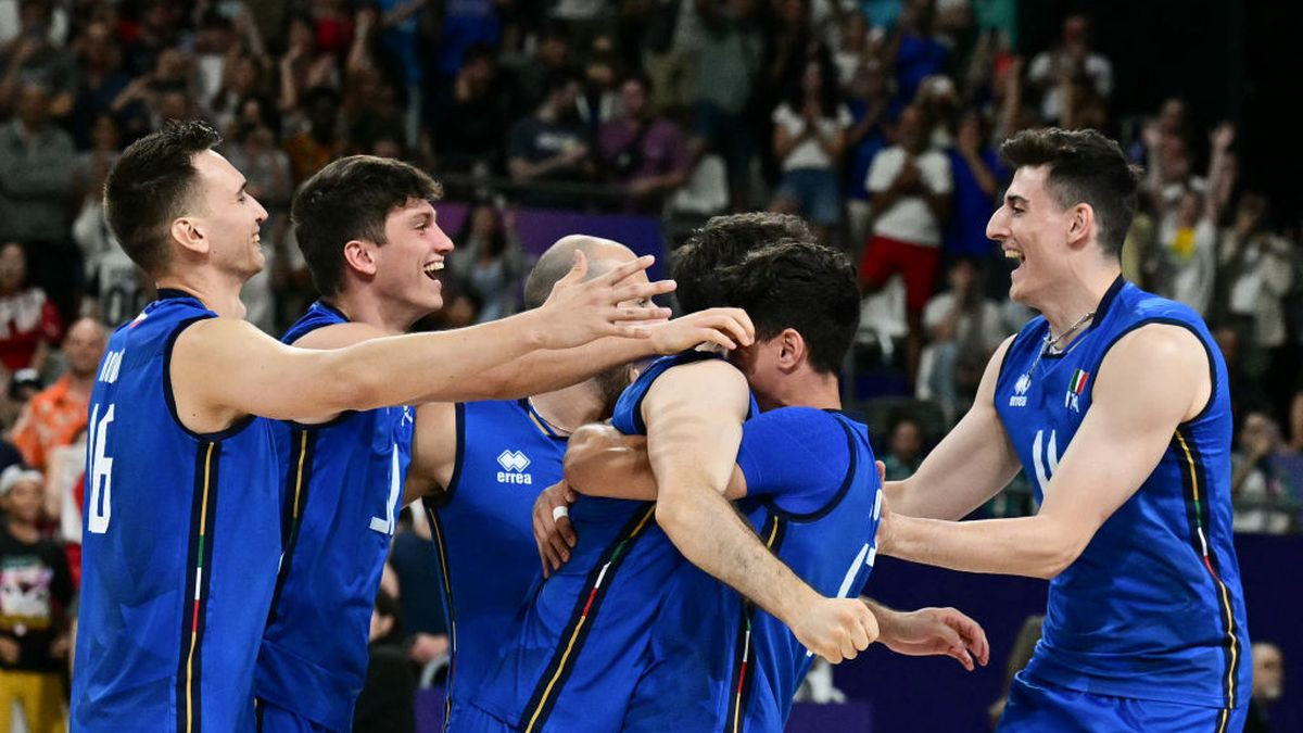 Italy's players celebrate after winning the volleyball men's quarter-final match between Italy and Japan. GETTY IMAGES