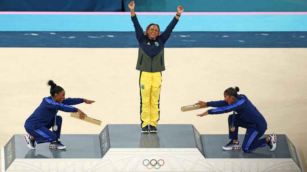 Gold medalist Rebeca Andrade (C) of Team Brazil, silver medalist Simone Biles (L) of Team United States and bronze medalist Jordan Chiles (R) of Team United States . GETTY IMAGES