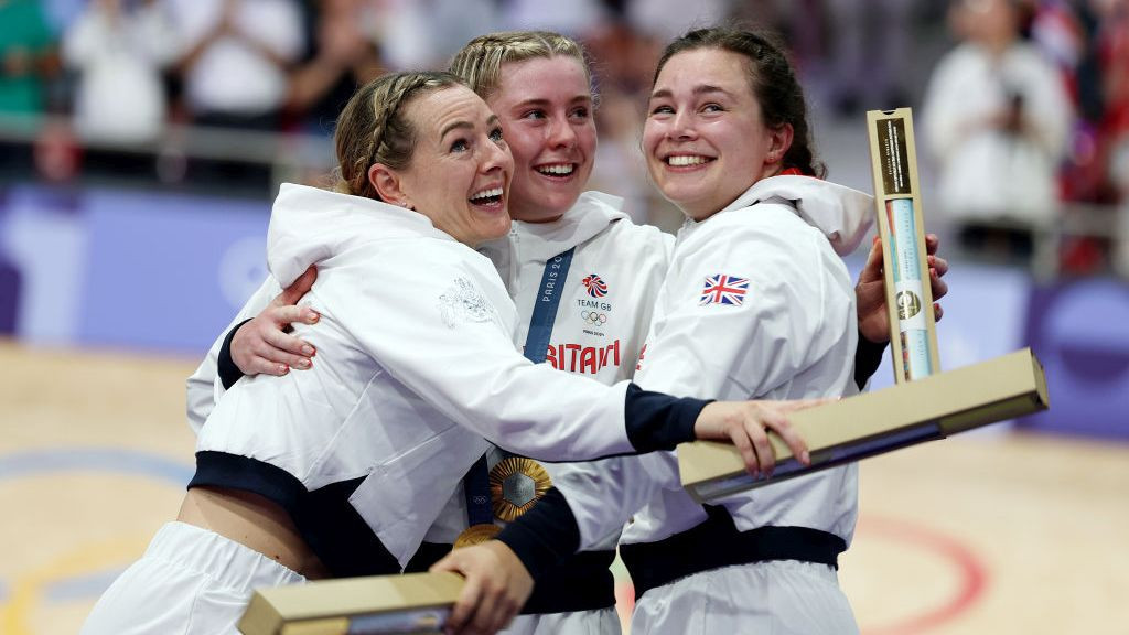 Gold medalists Katy Marchant, Sophie Capewell and Emma Finucane of Team Great Britain celebrate on the podium during the Women’s Team Sprint. GETTY IMAGES