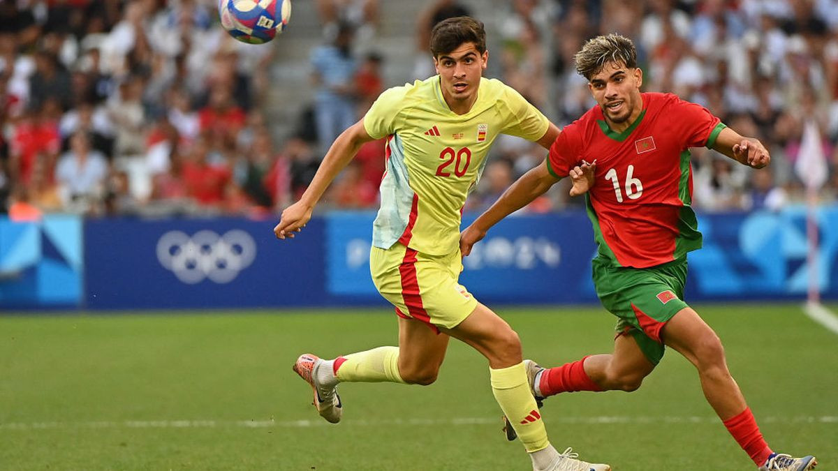 Spain's defender #20 Junlu Sanchez (L) and Morocco's forward #16 Abde Ezzalzouli eye the ball during the men's semi-final football match between Morocco and Spain. GETTY IMAGES