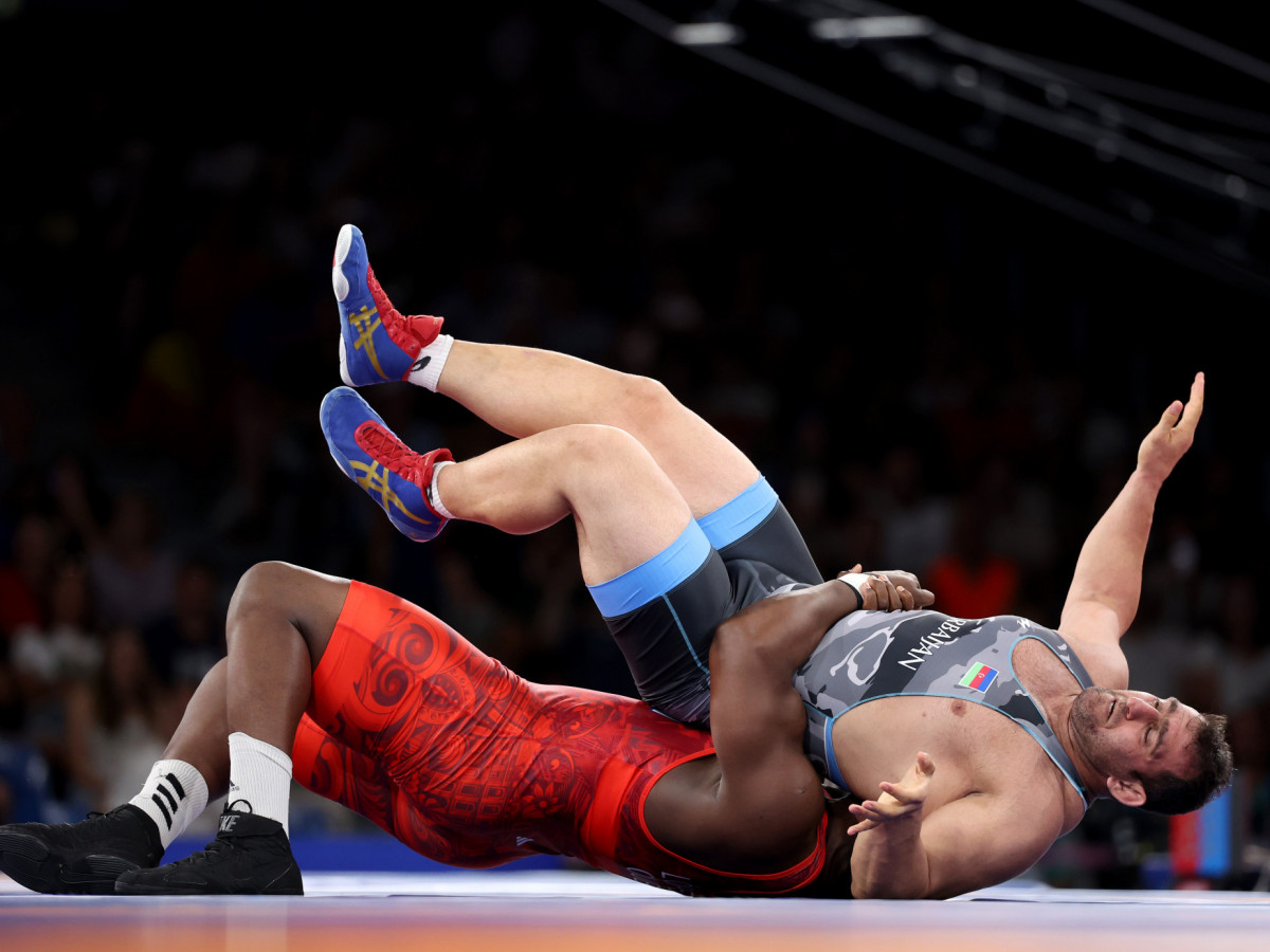 Mijain Lopez Nunez of Team Cuba competes with Sabah Saleh Aze Shariati of Team Azerbaijan during the Wrestling Men's Greco Roman 130kg Semifinal at the Paris 2024 Olympic Games. GETTY IMAGES