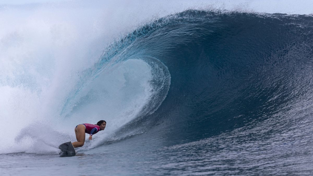 Caroline Marks rides a wave during the women's gold medal match of surfing. GETTY IMAGES