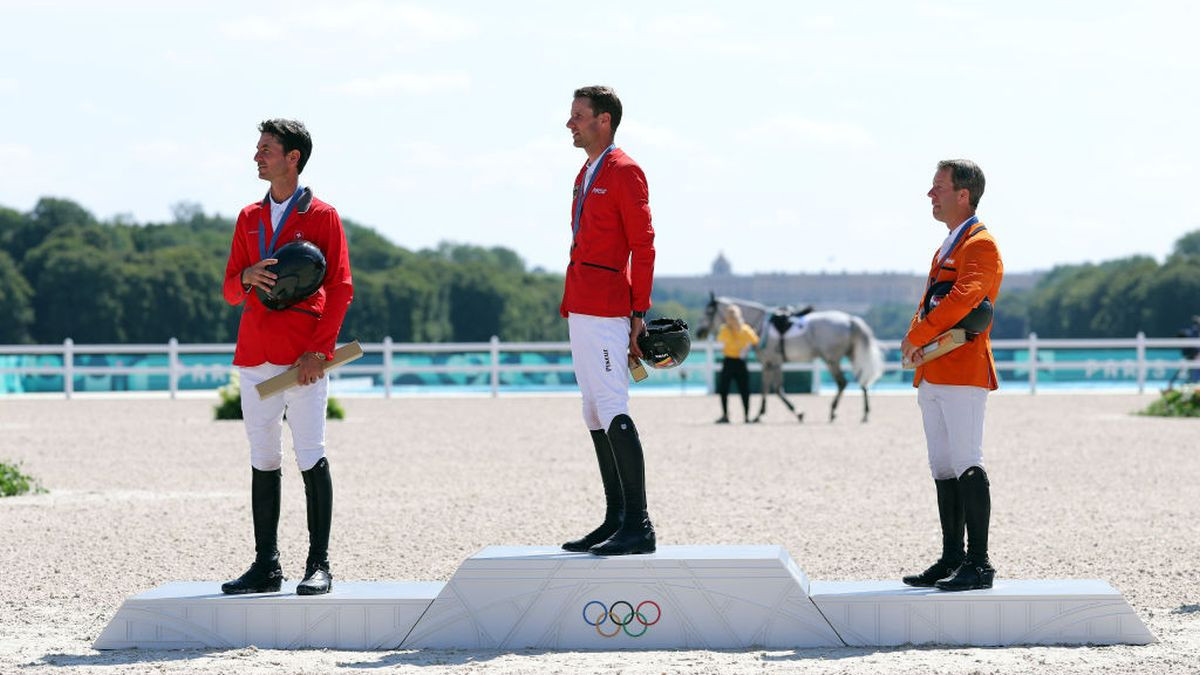 Silver medalist Steve Guerdat of Switzerland, gold medalist Christian Kukuk of Germany and bronze medalist Maikel Van Der Vleuten of Team Netherlands take part in the medal ceremony for the Jumping Individual Final. GETTY IMAGES