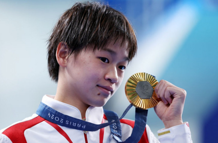 Quan Hongchan reclaims Olympic gold in 10m platform diving. GETTY IMAGES