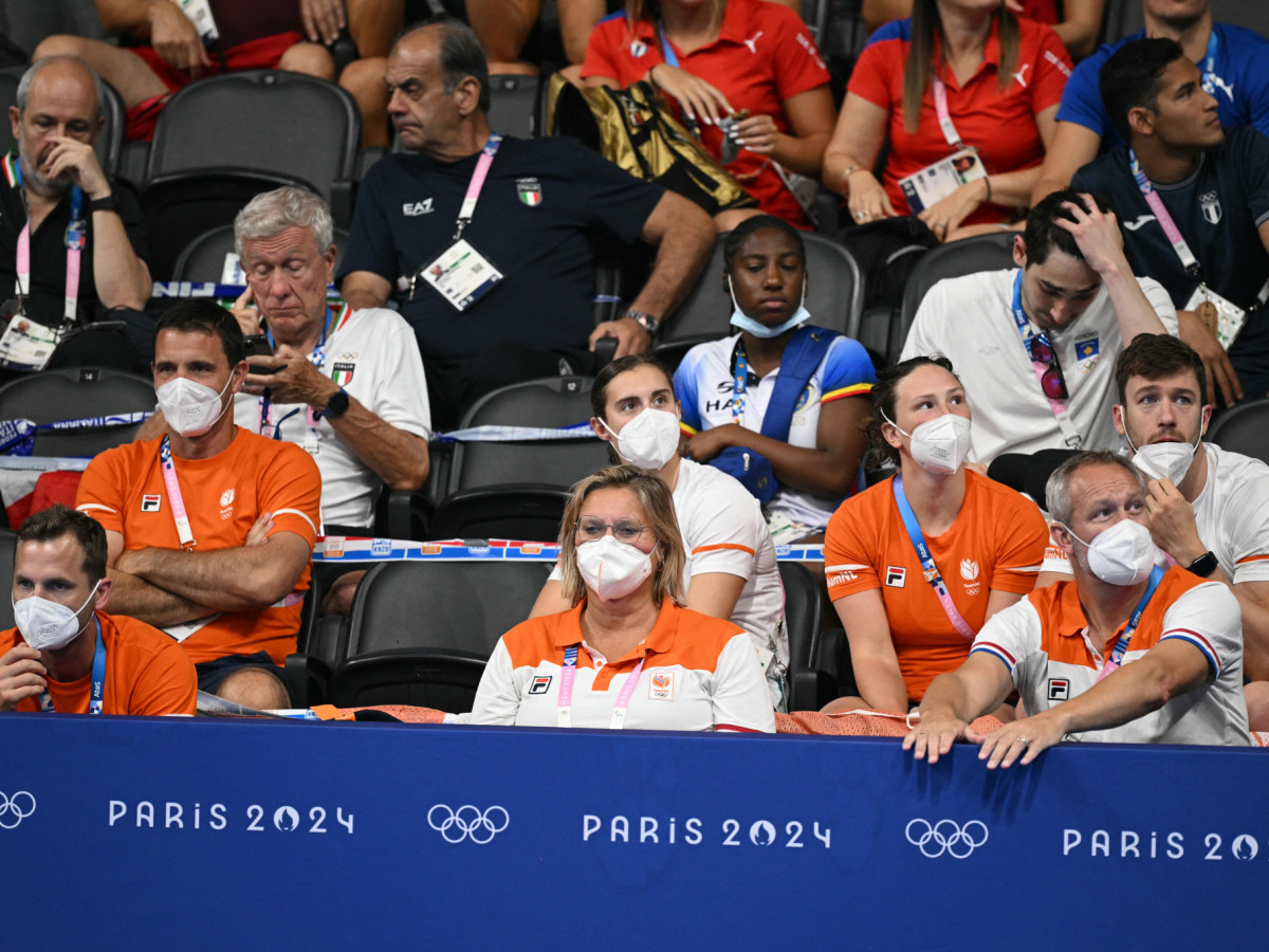 Coaches from the Netherlands wearing face masks at a swimming event during the Paris 2024 Olympic Games. GETTY IMAGES