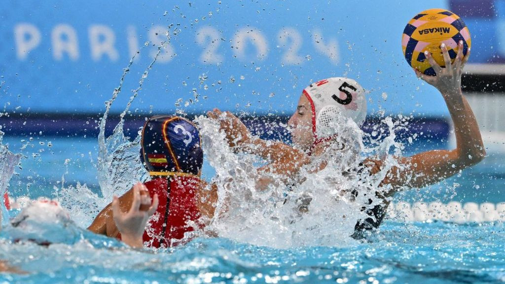 Marilia Mimides shoots the ball in the women's water polo quarterfinal match between Canada and Spain. GETTY IMAGES